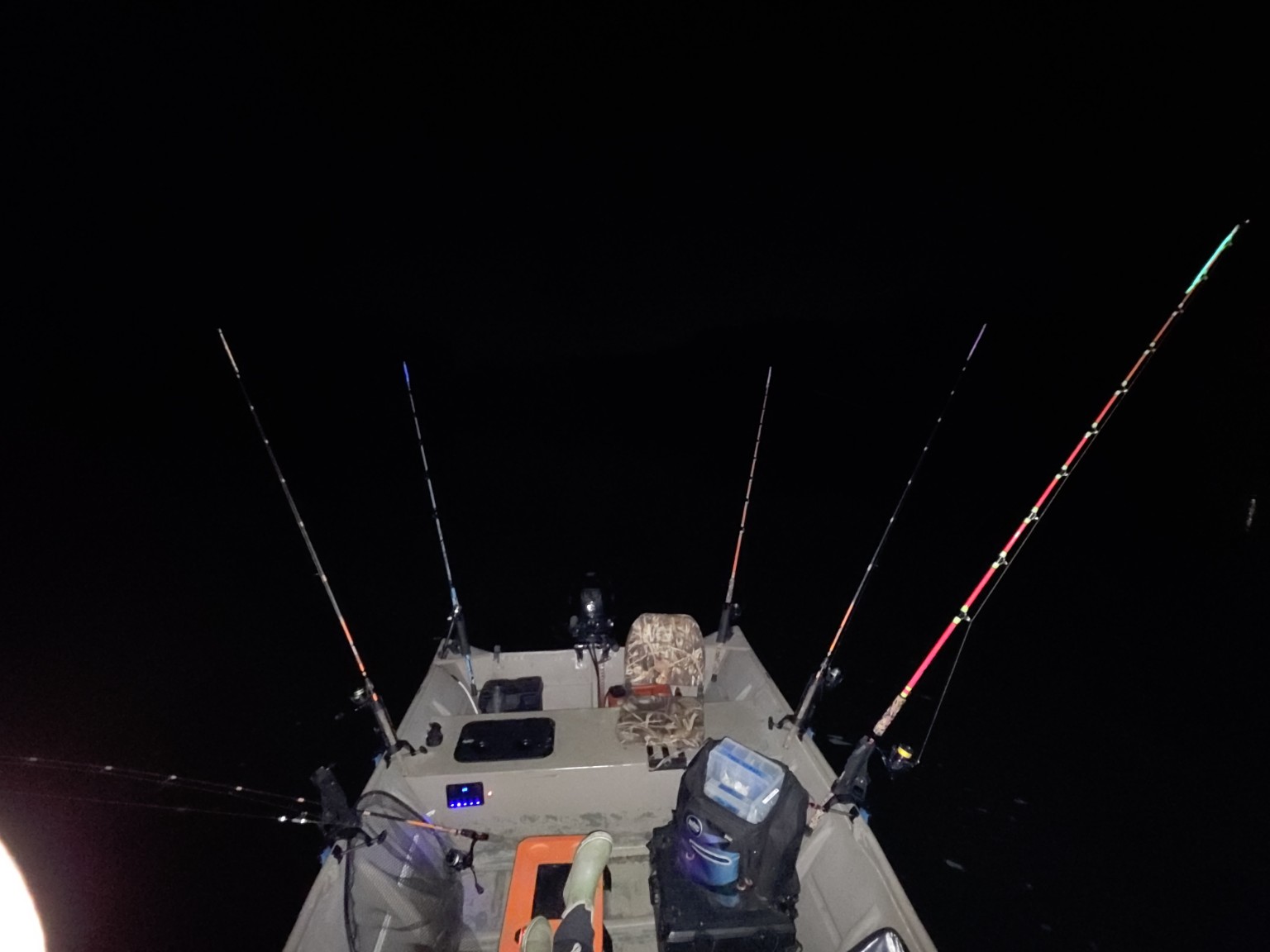 View from inside the CatManDue Jon Boat with fishing rods set for a night trip